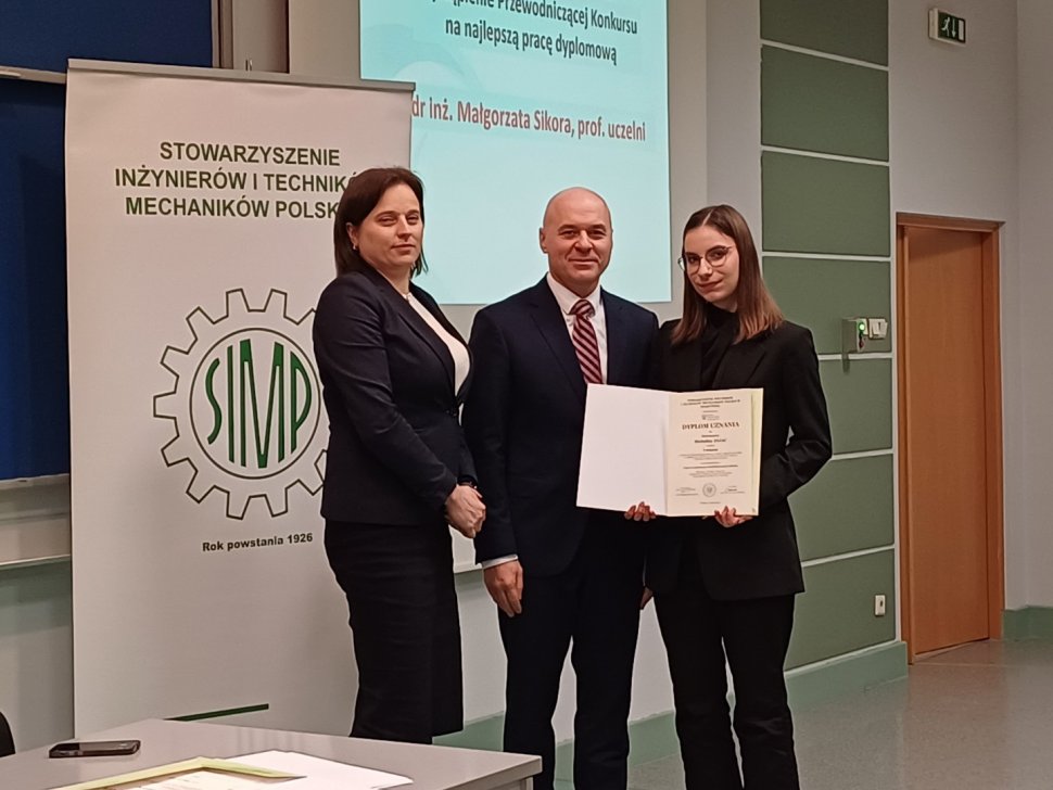 Representatives of the SIMP Association with the awarded student holding her diploma
