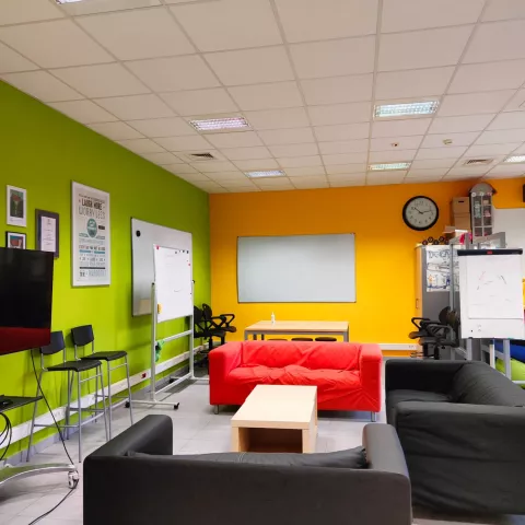 Active learning methods room - a creative design room with colorful sofas and boards hanging on the wall