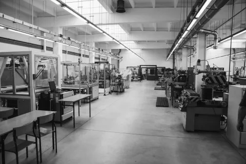 View of the technological hall with mechanical machines. Black and white photo